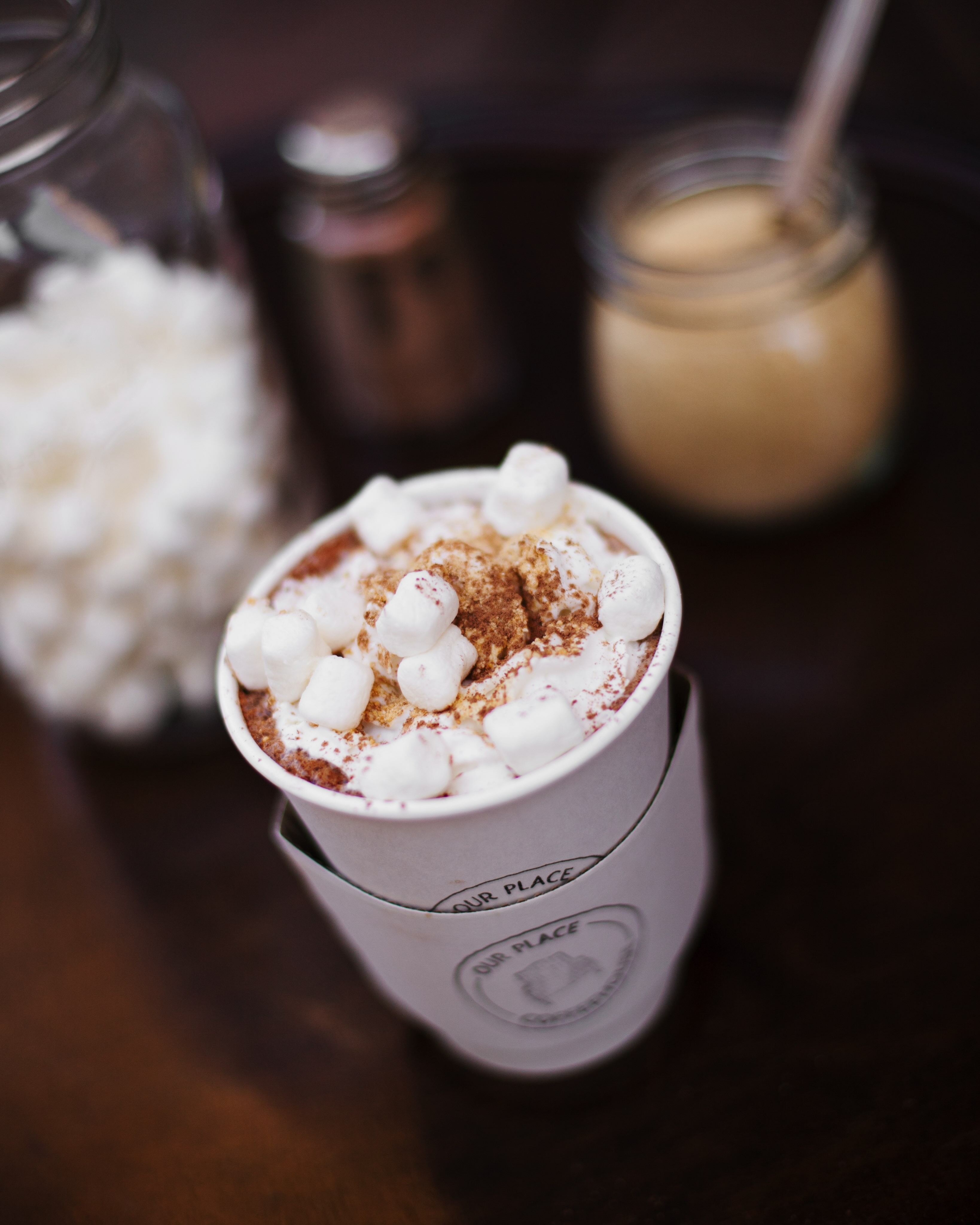 A s'more mocha topped with whipped cream and marshmallows
